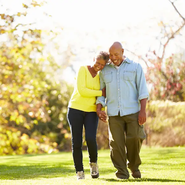 Couple walking on grass